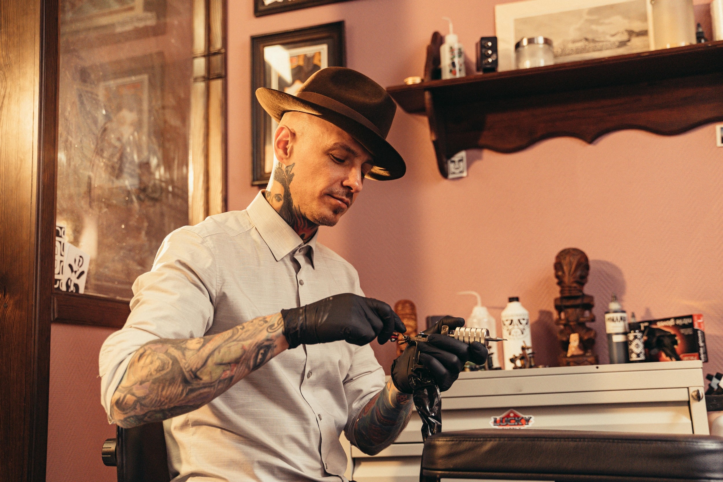 a man holding tattoo and piercing tools.